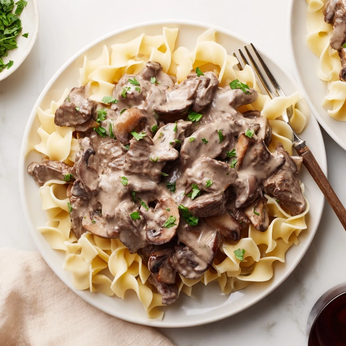 Tender strips of beef stroganoff with mushroom gravy served atop buttery egg noodles.