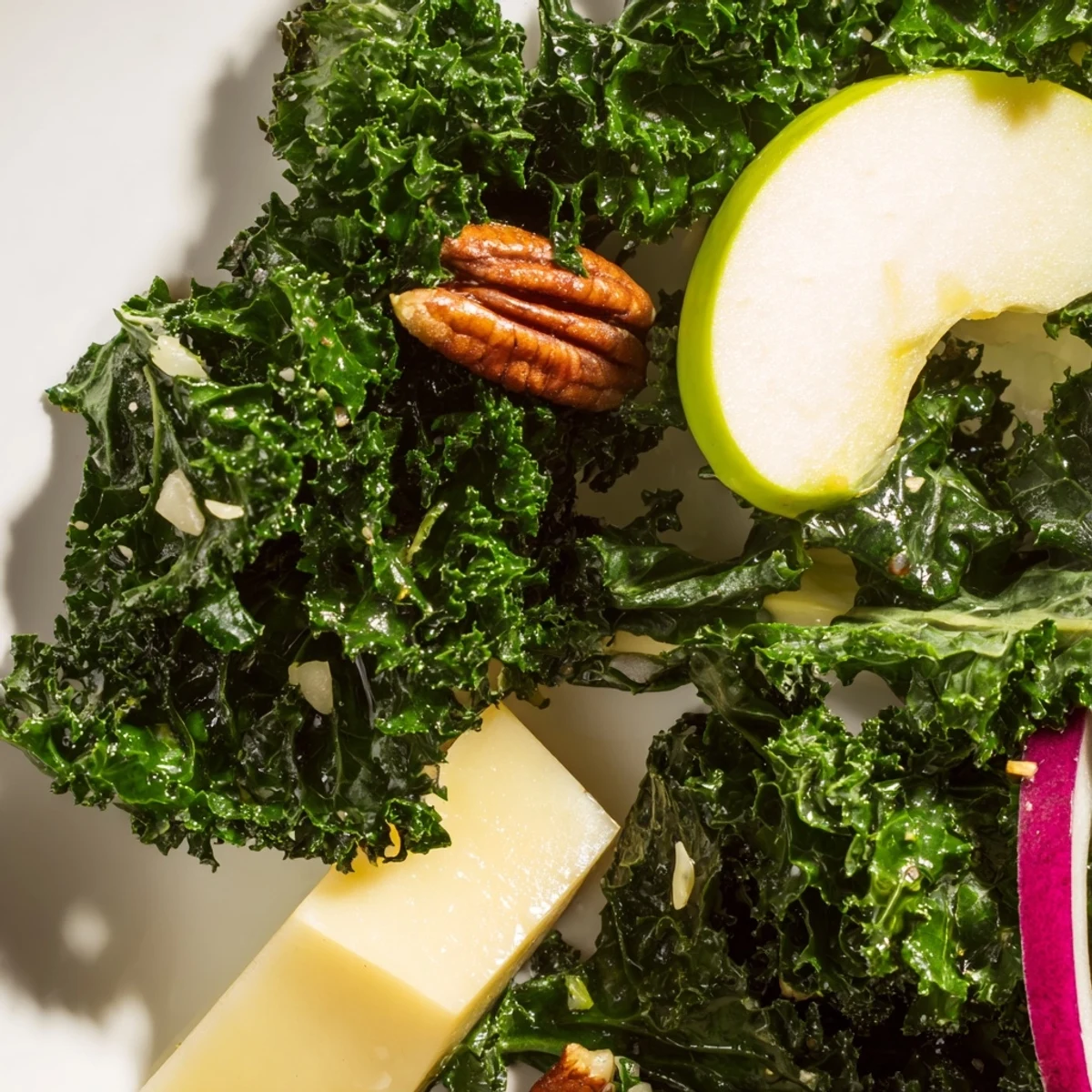 Freshly massaged kale topped with crisp apple slices, sharp cheddar cubes, and toasted pecans, drizzled with tangy apple cider vinaigrette.