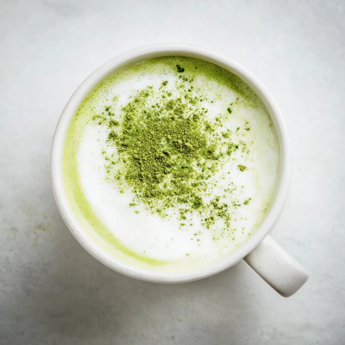 Creamy Green Matcha Latte with Oat Milk served warm in a ceramic mug, ready for a gentle morning energy boost.