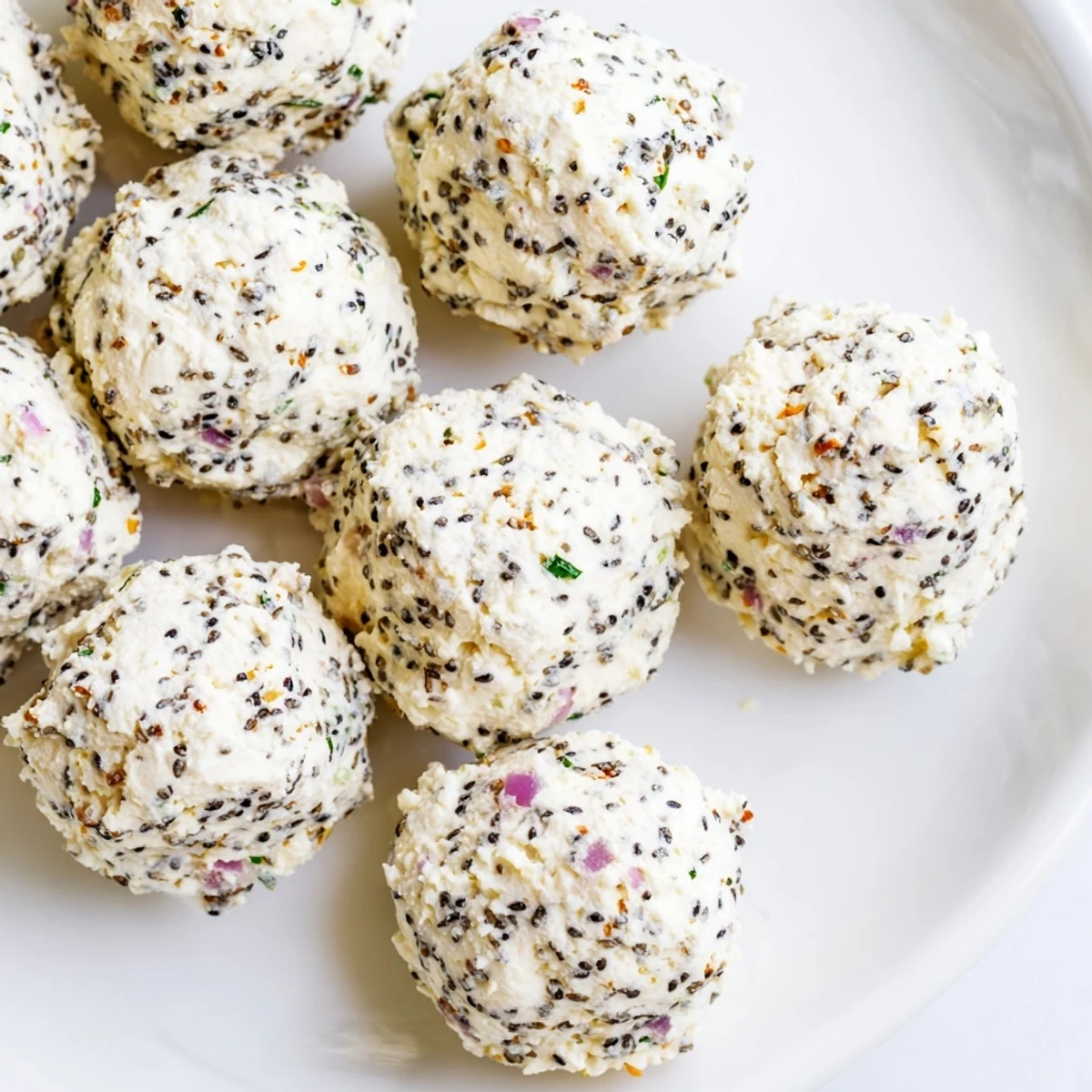 Gluten-free vegetarian Everything Bagel Cottage Cheese Bites arranged on a platter, ready for a party appetizer platter.