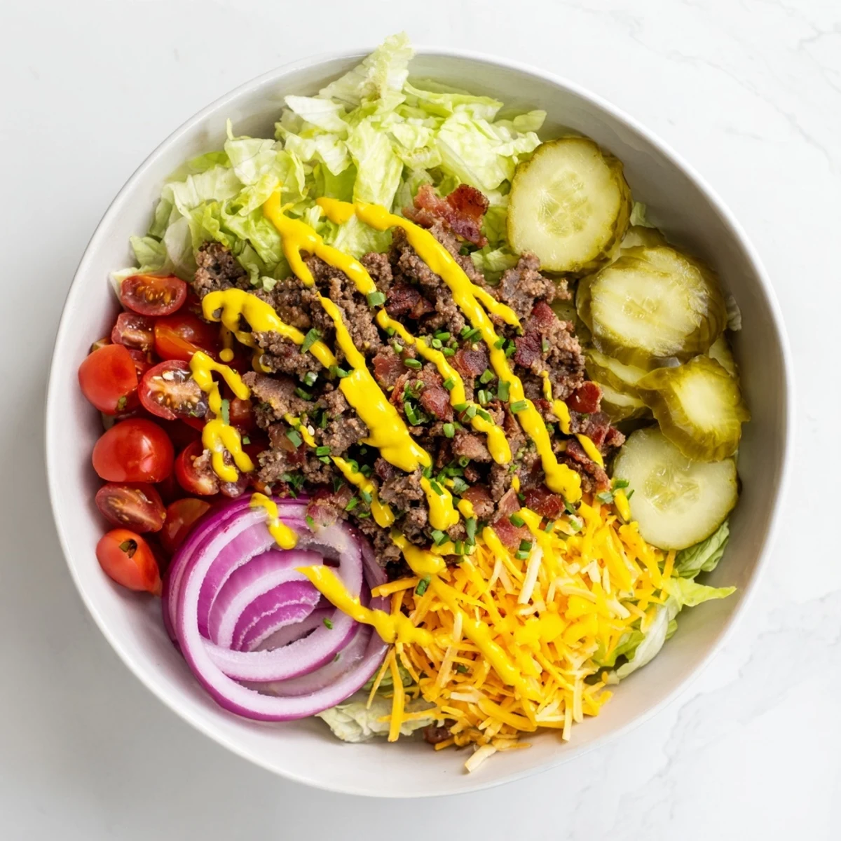A close-up of a Smash Burger Bowl loaded with crisp lettuce and drizzled with creamy Smash Sauce.