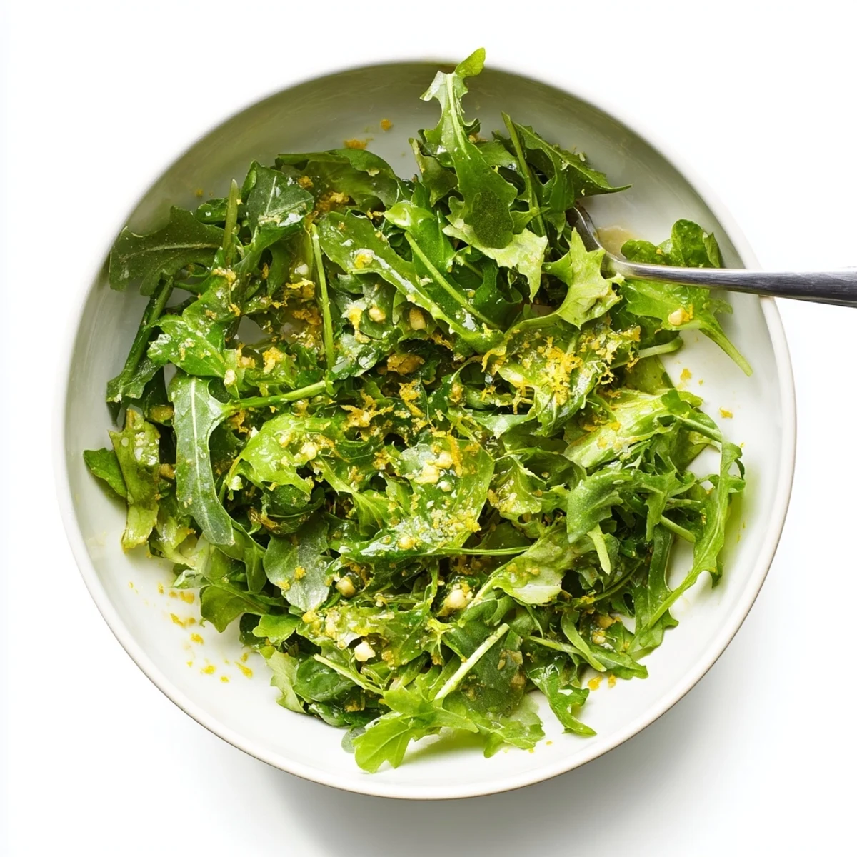 Smooth honey lemon vinaigrette emulsified in glass jar with lemon slices and honey drizzle backdrop