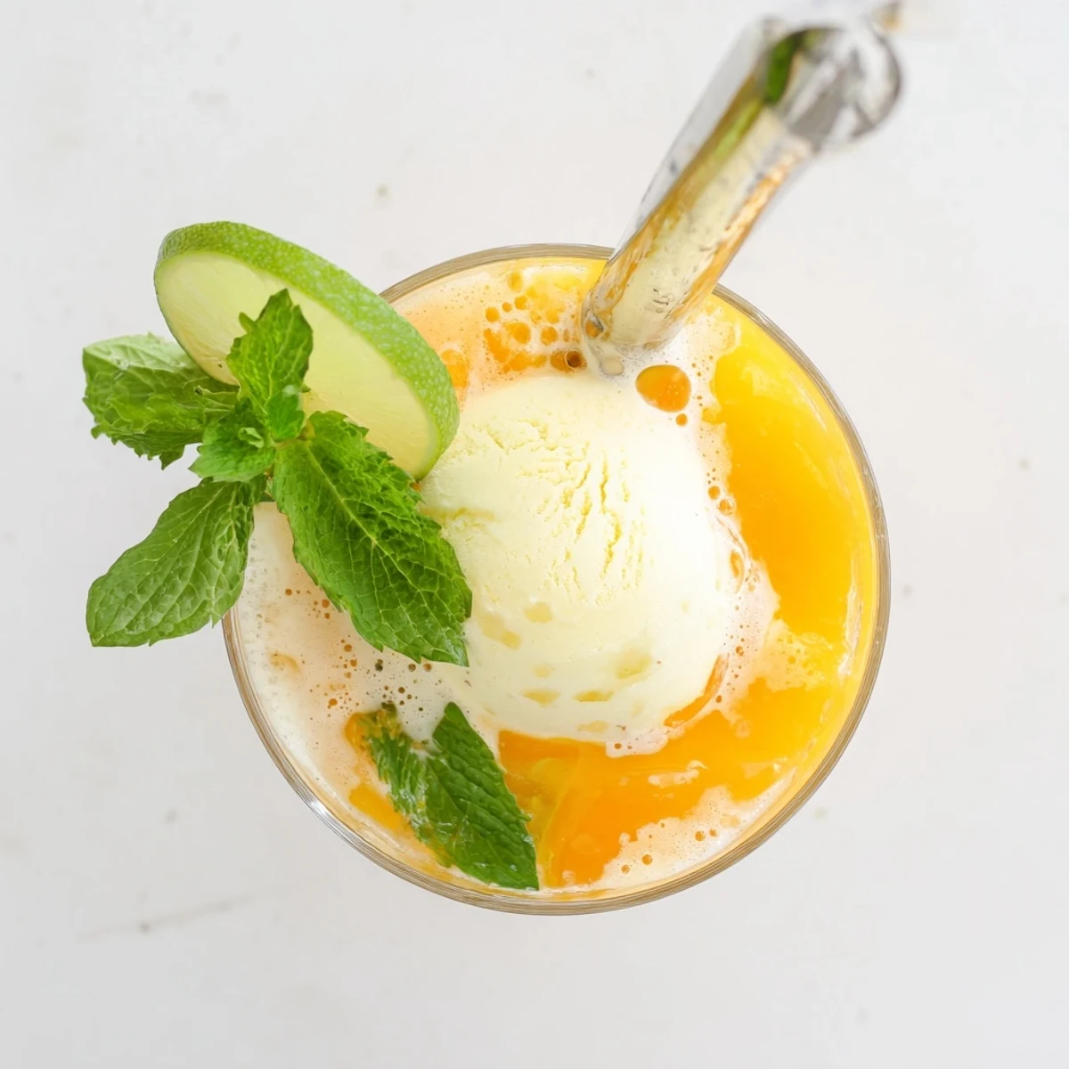 Vibrant mango ginger glow float featuring fizzy sparkling water and ice cream