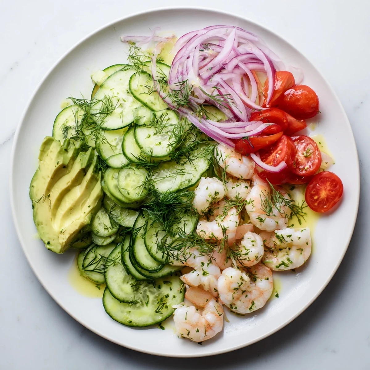 Fresh cucumber shrimp salad bowl with crisp vegetables and zesty lemon herb dressing