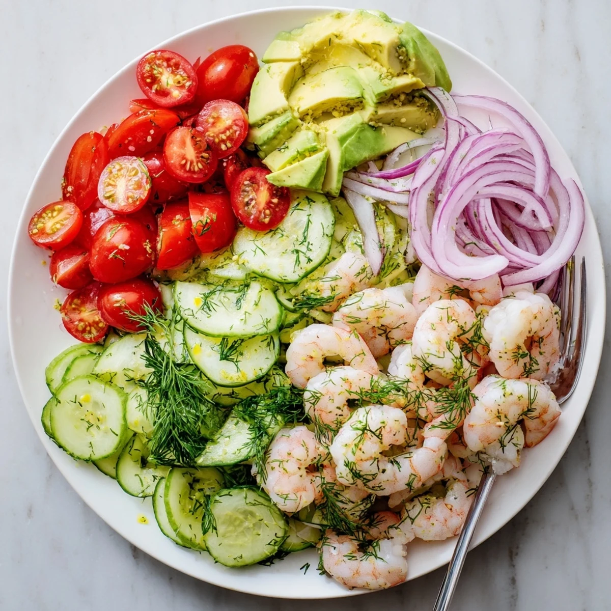 Tender shrimp tossed with sliced cucumbers, cherry tomatoes, and avocado in light olive oil dressing