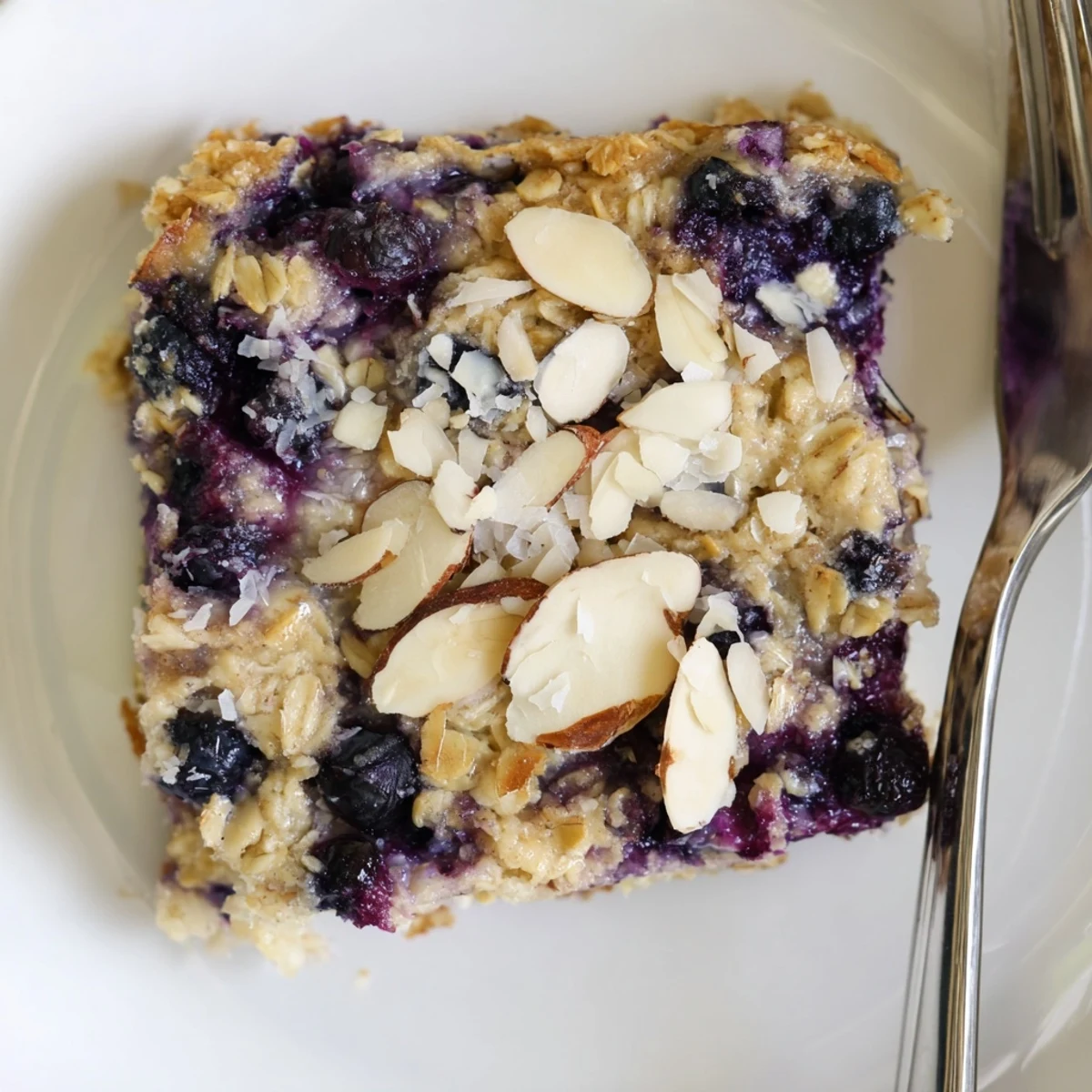 Creamy blueberry cottage cheese breakfast bake served in a square dish with golden edges