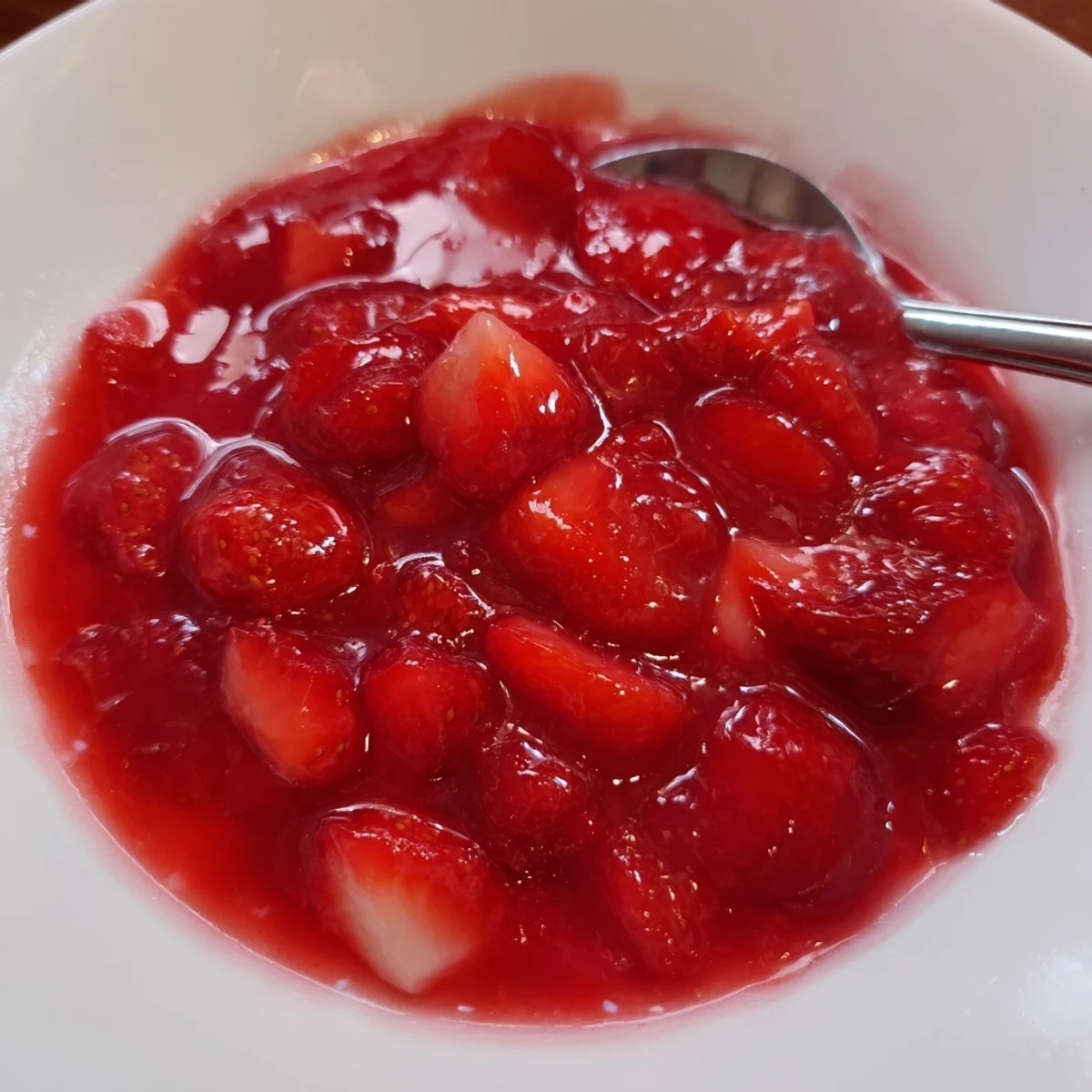 Strawberry Cake Filling Recipe glossy, jewel-red filling spooned into a cake layer