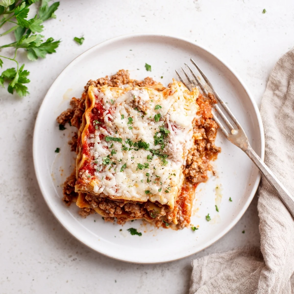 Aromatic Slow Cooker Lasagna with rich meat sauce, melted mozzarella topping.