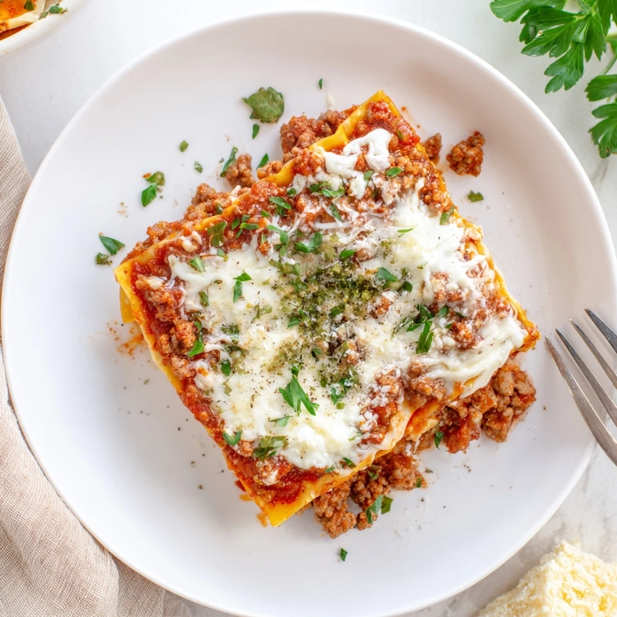 Serve slow, fork-cut slices of Slow Cooker Lasagna with garlic bread.