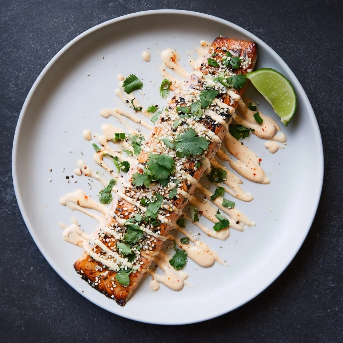 Bang Bang Salmon drizzled with creamy spicy sauce over jasmine rice