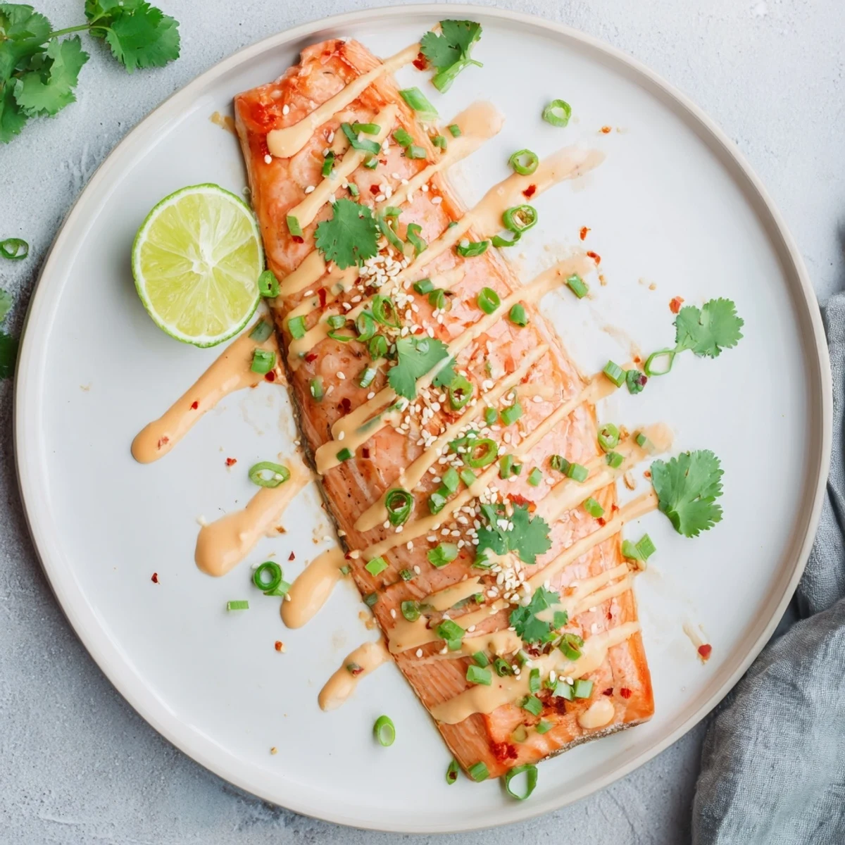 Flaky Bang Bang Salmon glazed in sweet-tangy sauce, sesame seeds sprinkled