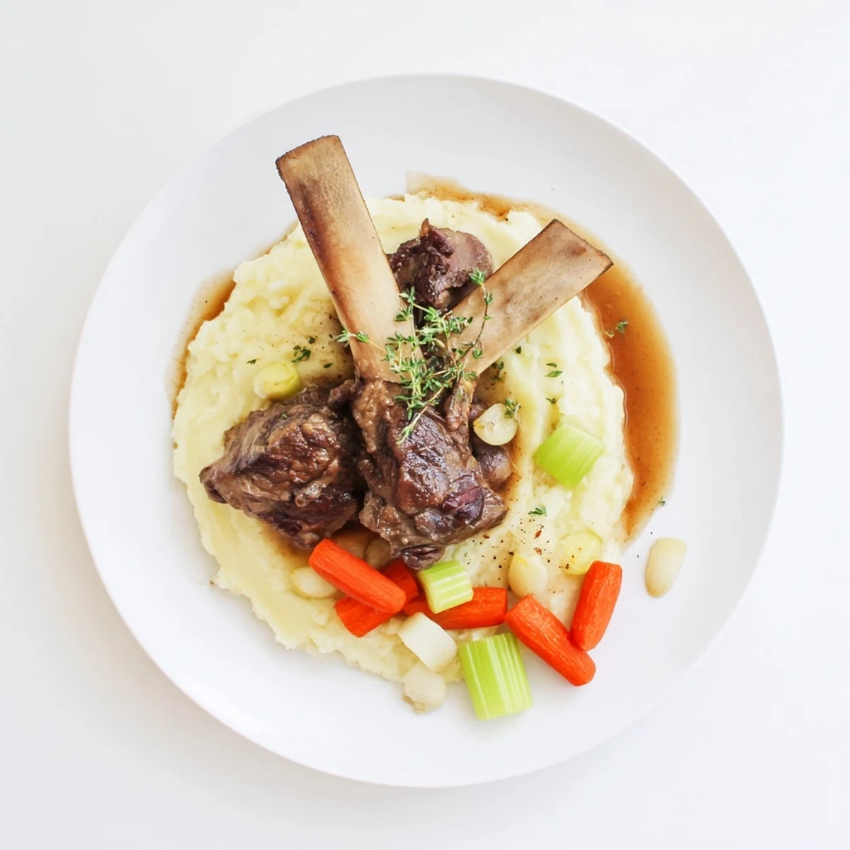Slow Cooker Short Ribs falling off the bone, savory sauce pooling around vegetables