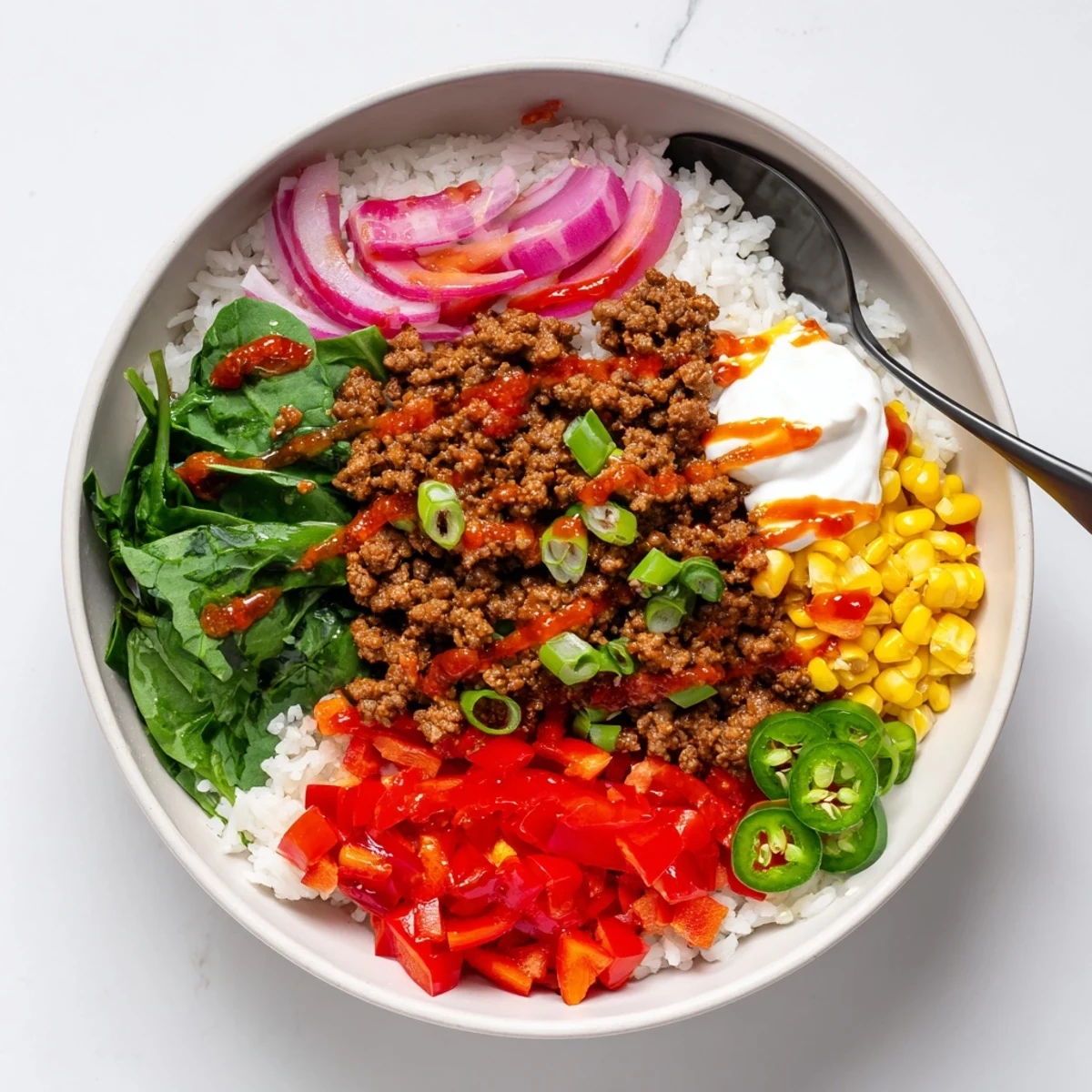 Bright Viral Ground Beef Hot Honey Bowl over fluffy rice with pickled jalapeños