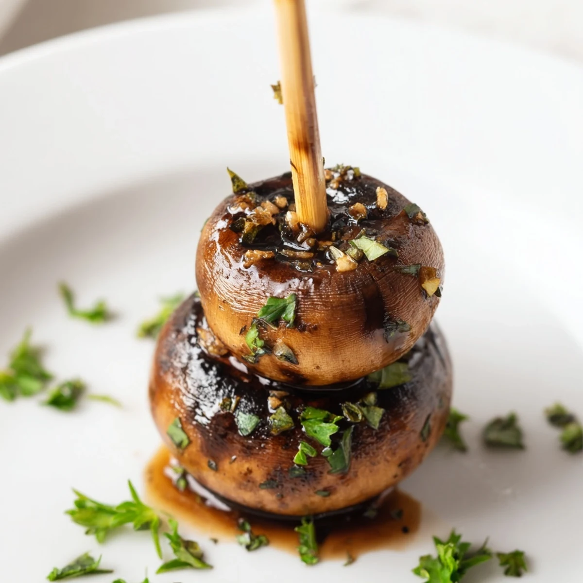 Balsamic Garlic Grilled Mushroom Skewers glistening with charred edges and parsley