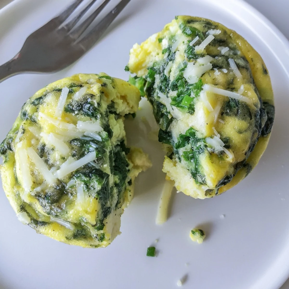 Savory Spinach Feta Egg Bites with golden tops and warm, fluffy centers