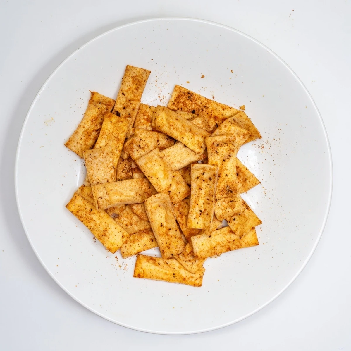 Vegan gluten-free chickpea chips served alongside creamy hummus for dipping