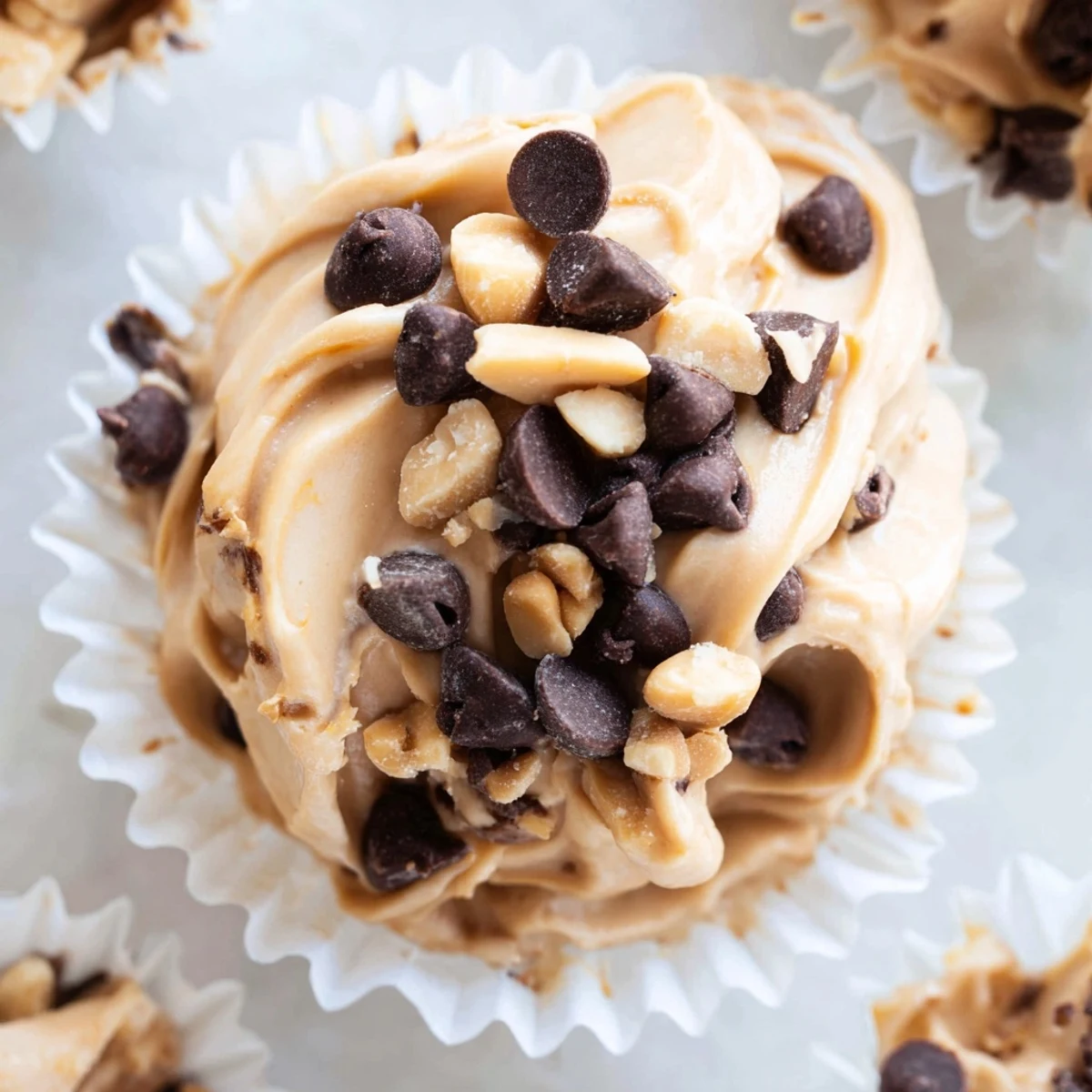 Delicious frozen peanut butter Greek yogurt bites showcasing smooth texture and dark chocolate drizzle topping