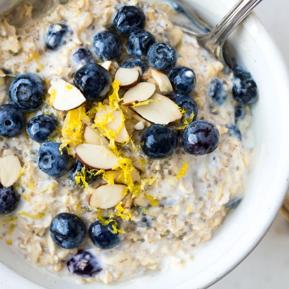 Chilled Blueberry Lemon Overnight Oats in jar, creamy texture with nutty crunch