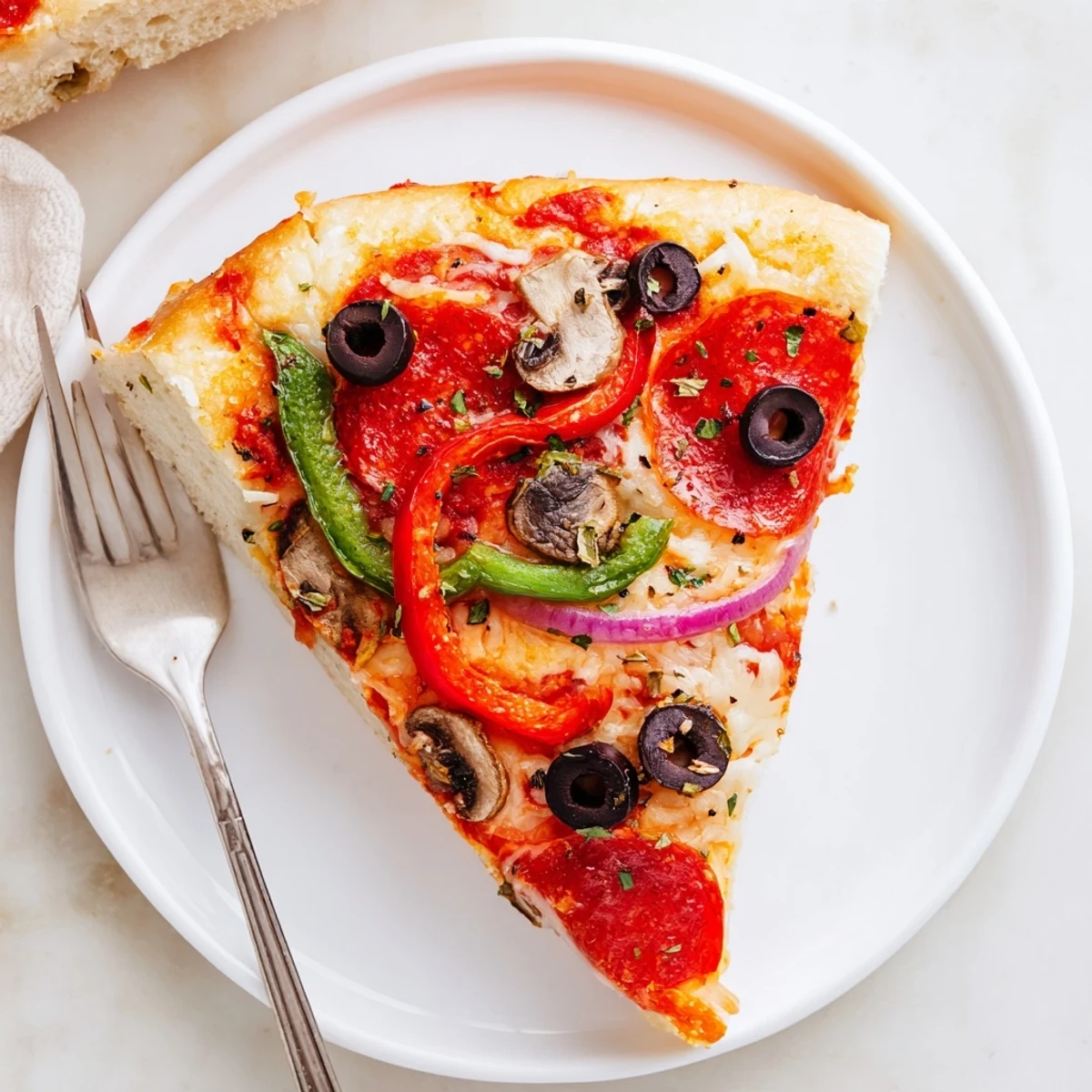 Focaccia Pizza Supreme with bubbling mozzarella, golden edges and fresh basil
