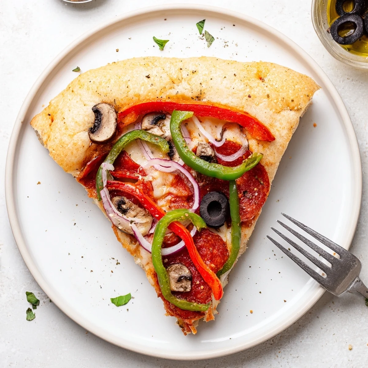 Chewy focaccia base in Focaccia Pizza Supreme topped with colorful veggies