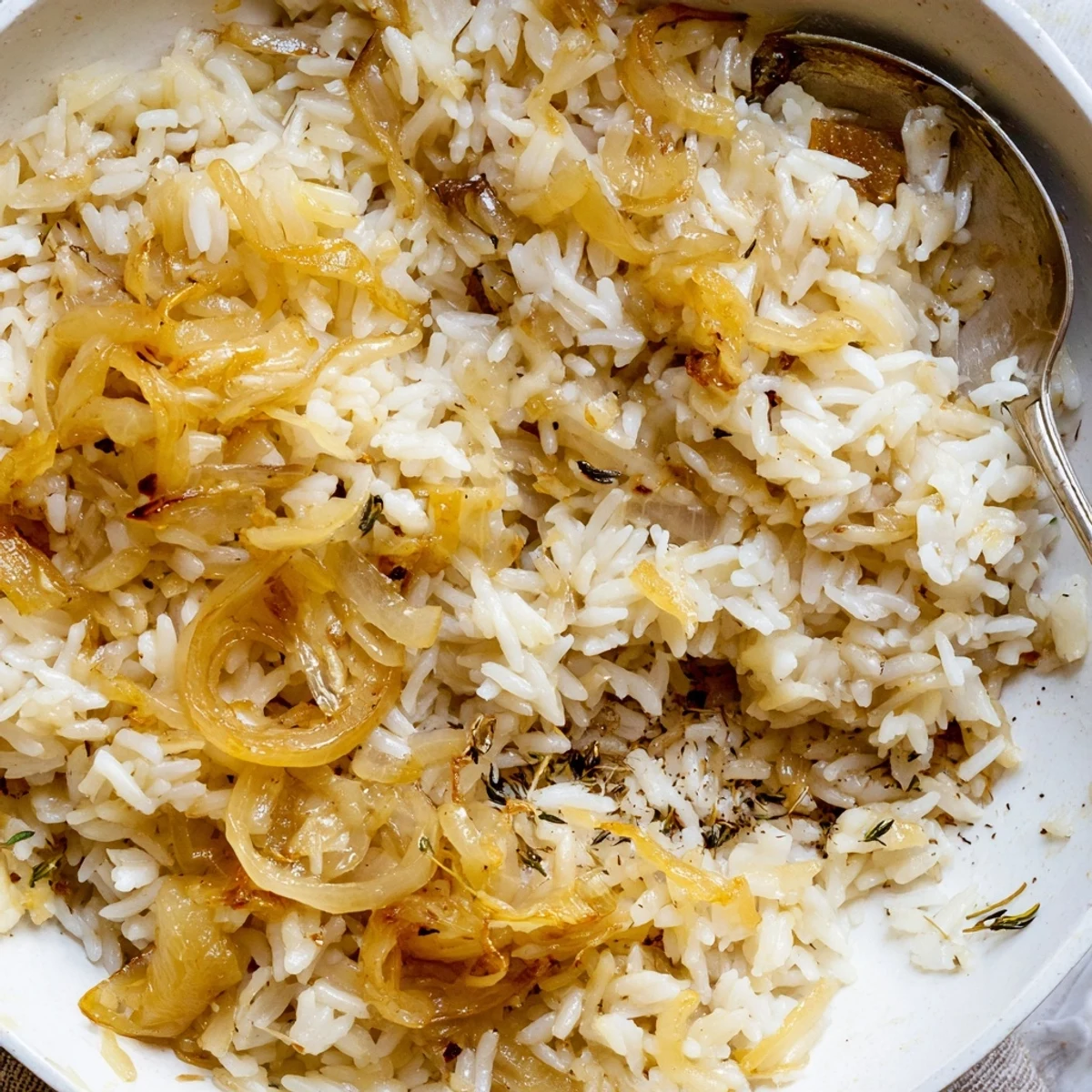 Hearty French Onion Soup Rice featuring tender grains, gooey cheese, crunchy bread cubes