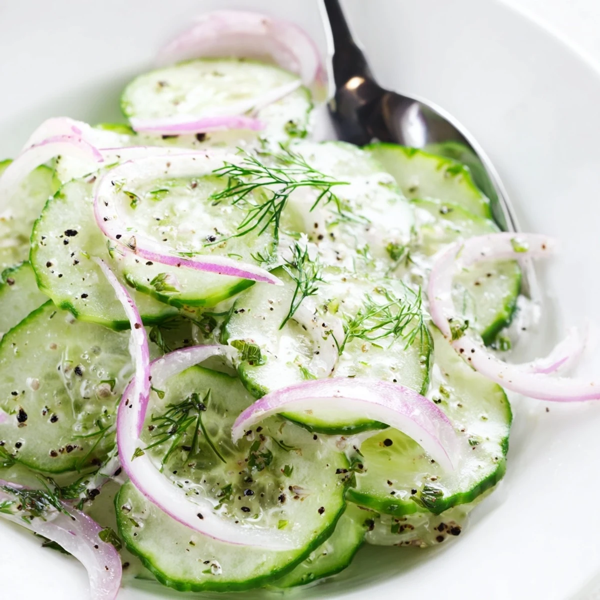 Cucumber Salad with thinly sliced cukes, dill, and tangy dressing chilled.