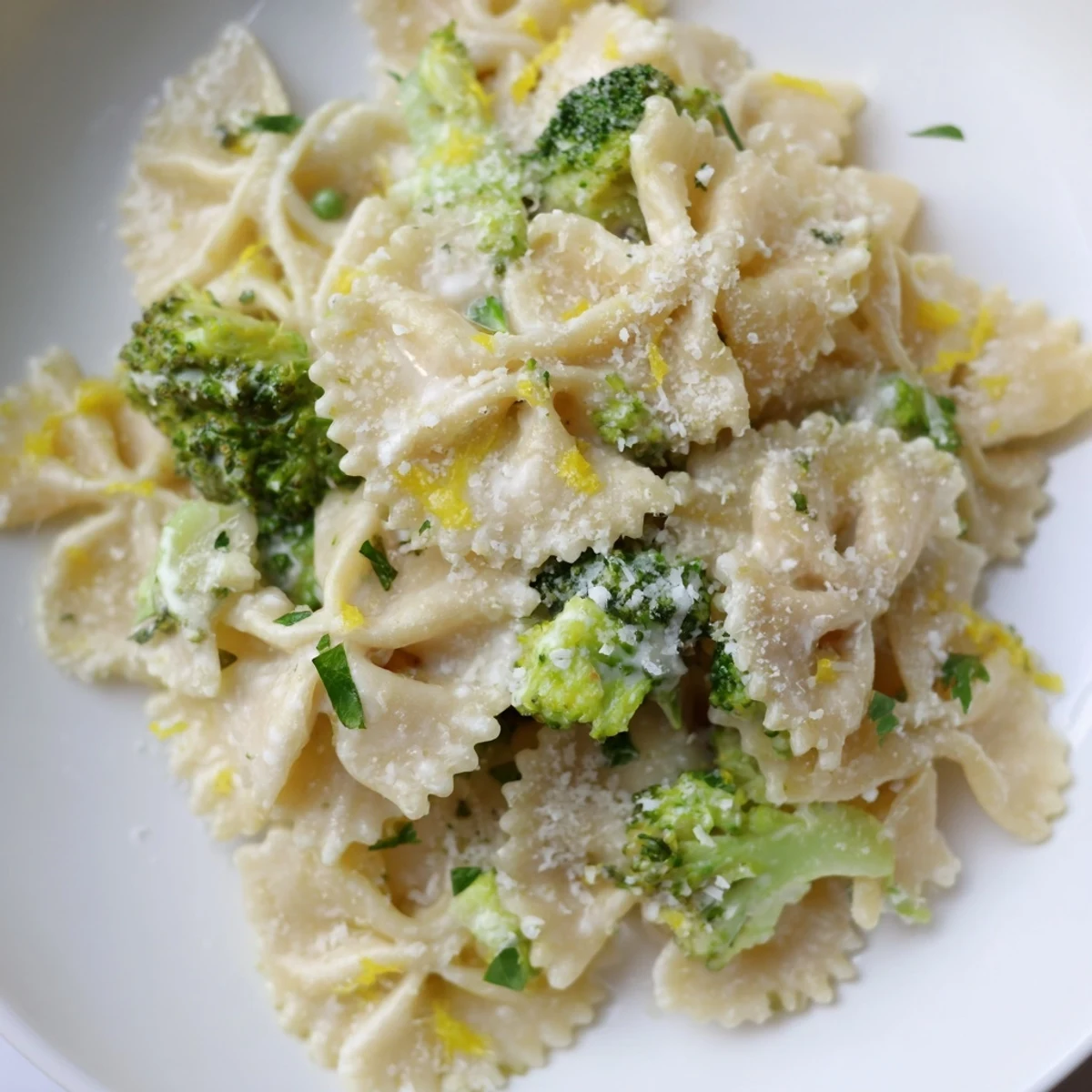 Creamy mafaldine pasta limone broccoli tossed in tangy lemon parmesan sauce with tender green florets