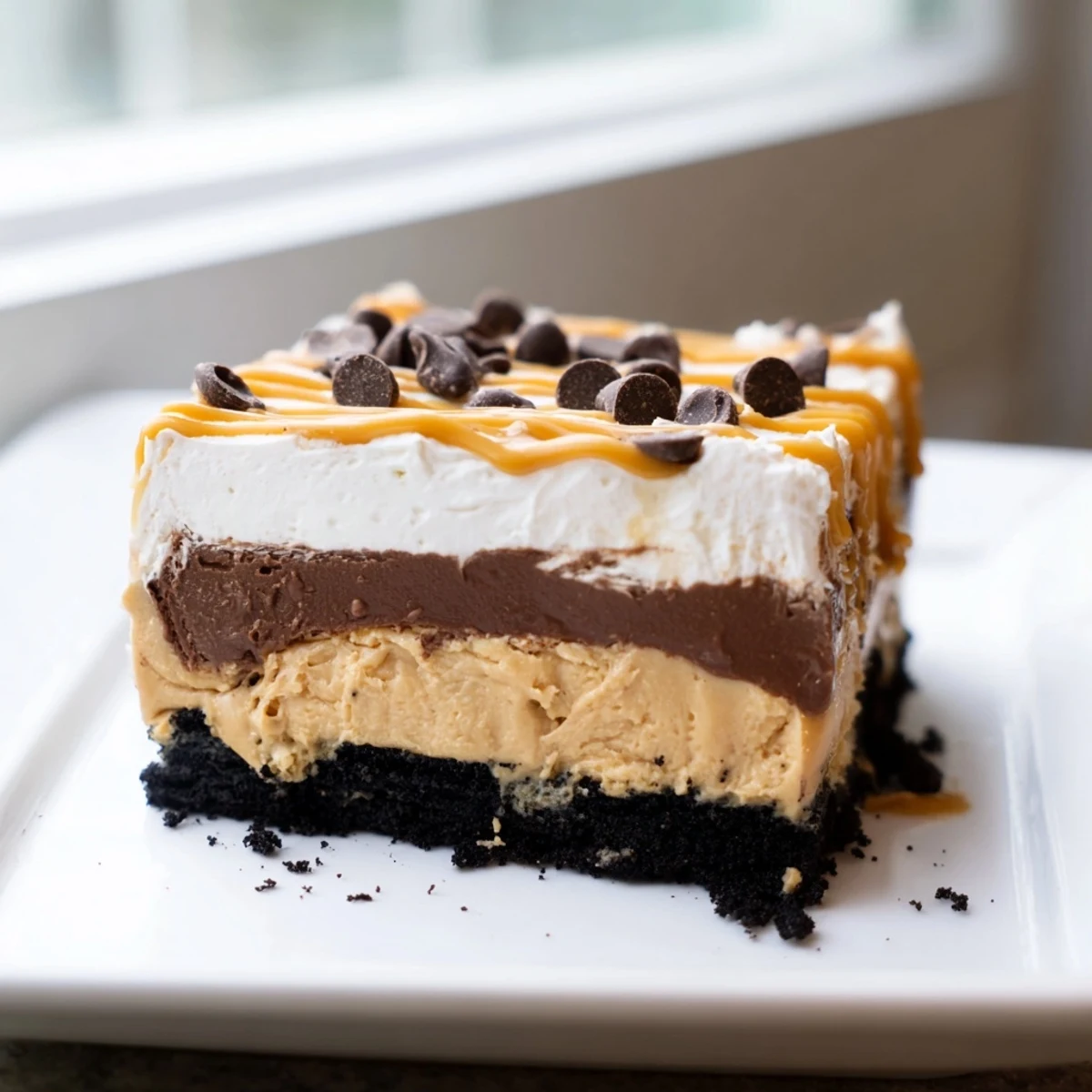 Creamy peanut butter layered delight with rich chocolate pudding and whipped topping
