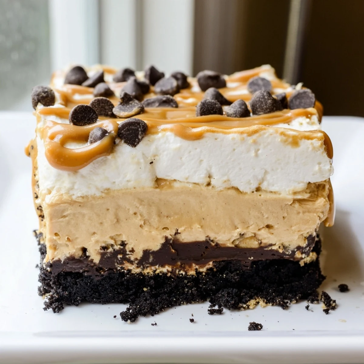 Peanut butter layered delight sliced into squares revealing indulgent chocolate and peanut butter