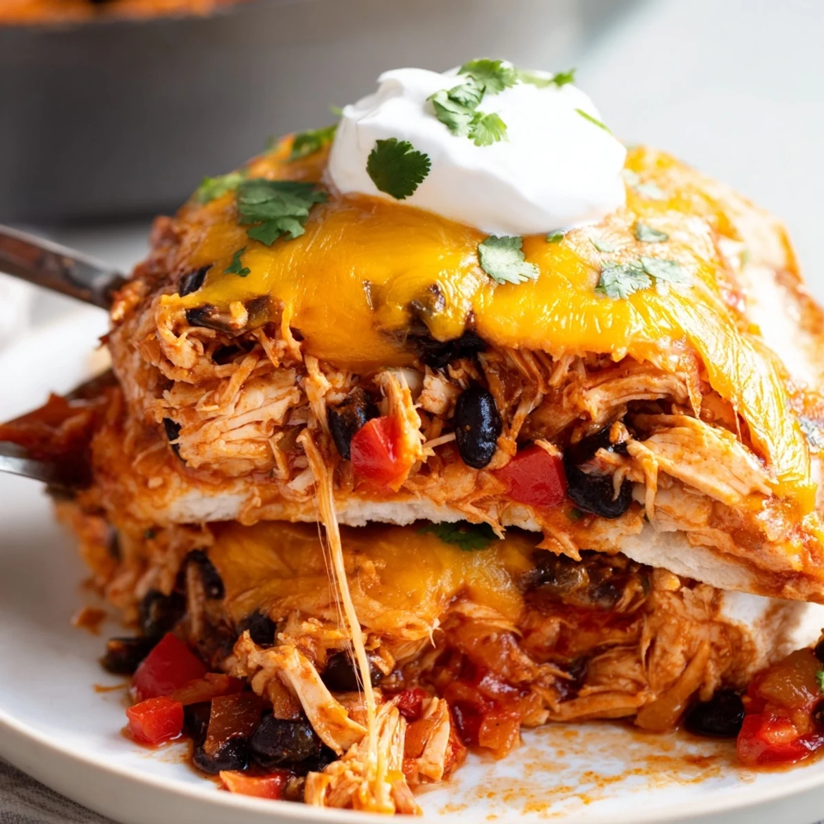 Golden bubbling chicken burrito casserole fresh from the oven with melted cheddar