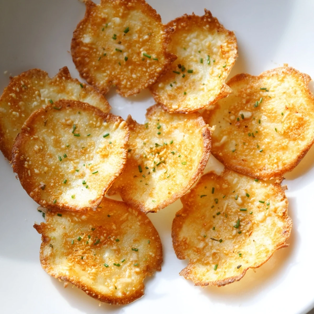 Golden crispy cottage cheese chips sprinkled with parmesan, fresh from the oven
