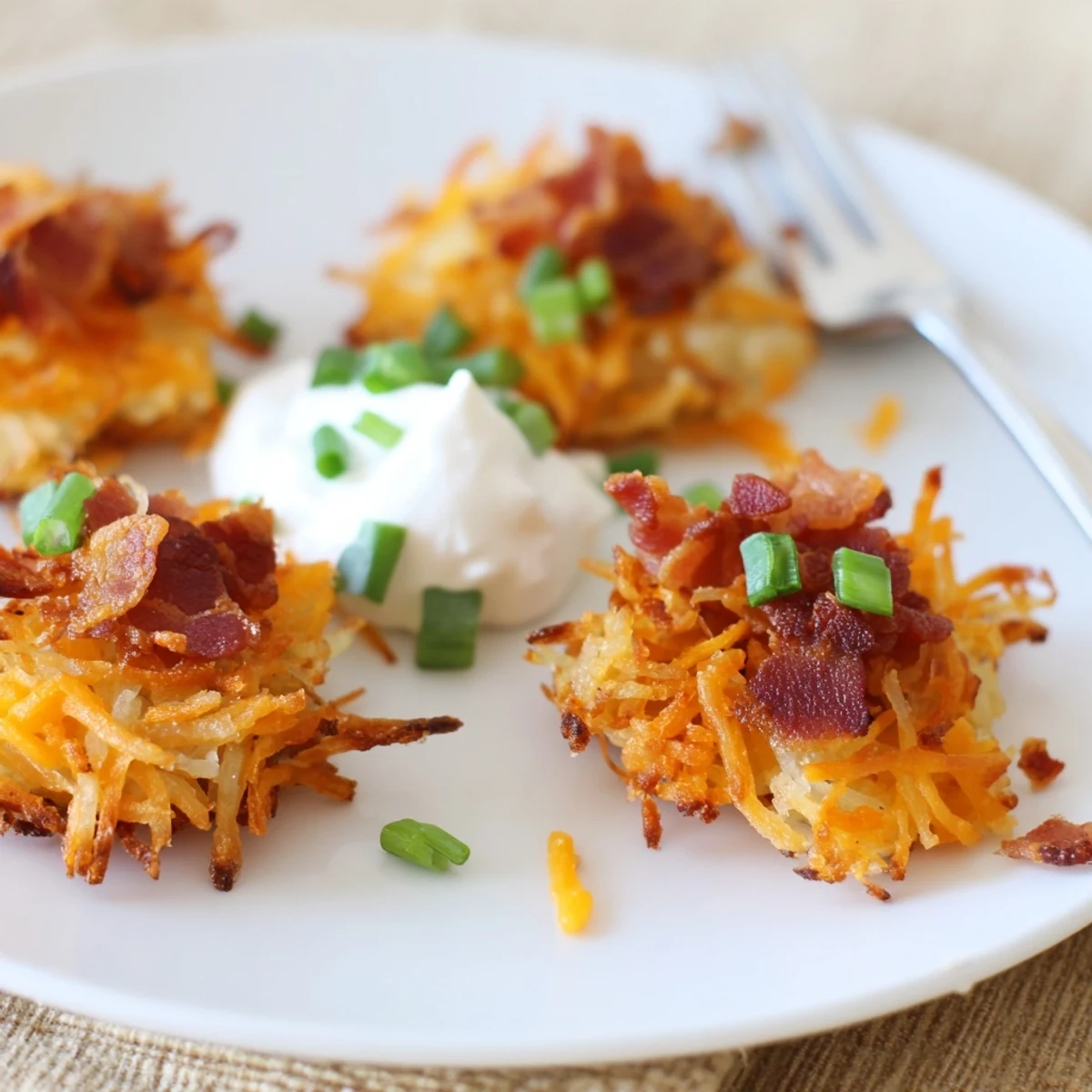 Cheesy Loaded Hashbrown Bites baked in a mini muffin tin until perfectly crispy