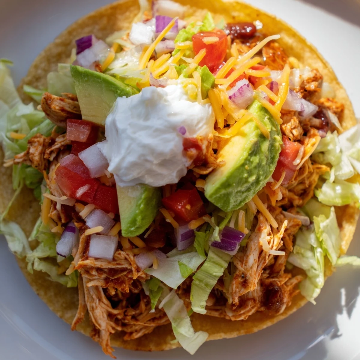 Golden corn tortillas topped with seasoned chicken and vibrant vegetables for dinner.