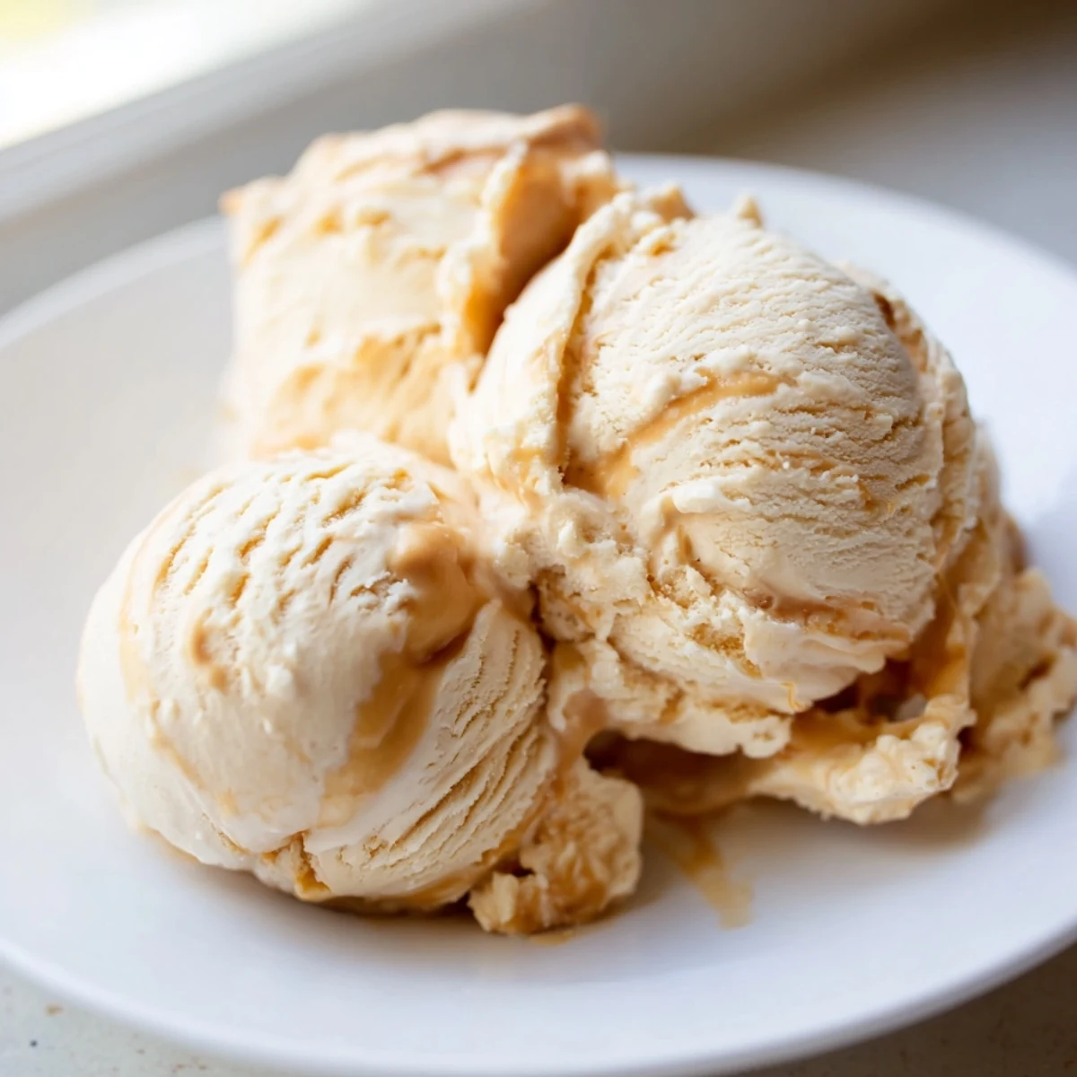 Creamy no churn salted caramel ice cream recipe swirled with golden caramel sauce.  
